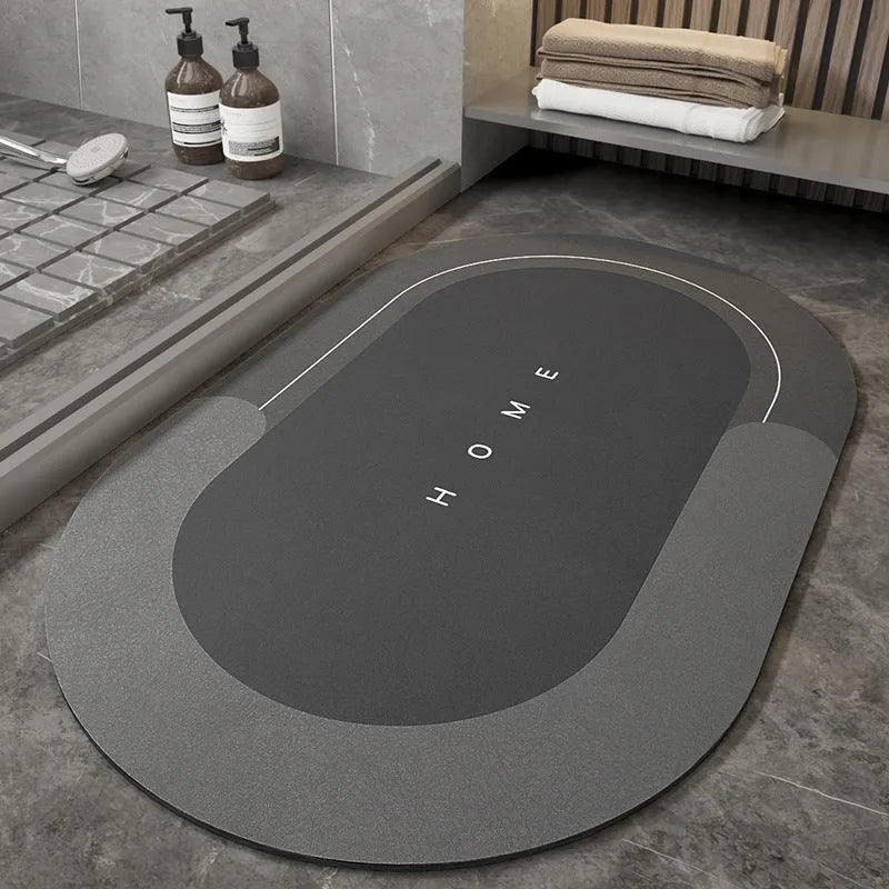 Blue oval blended fabric bathroom floor mat on a tiled floor
