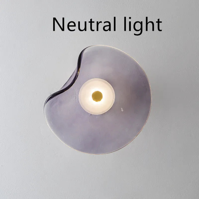 Round decorative wall lamp with glass shade for bedroom bedside lighting