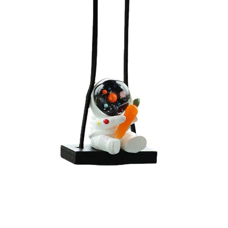 Resin cartoon astronaut car pendant showing designs like astronaut with telescope and astronaut holding a radish.