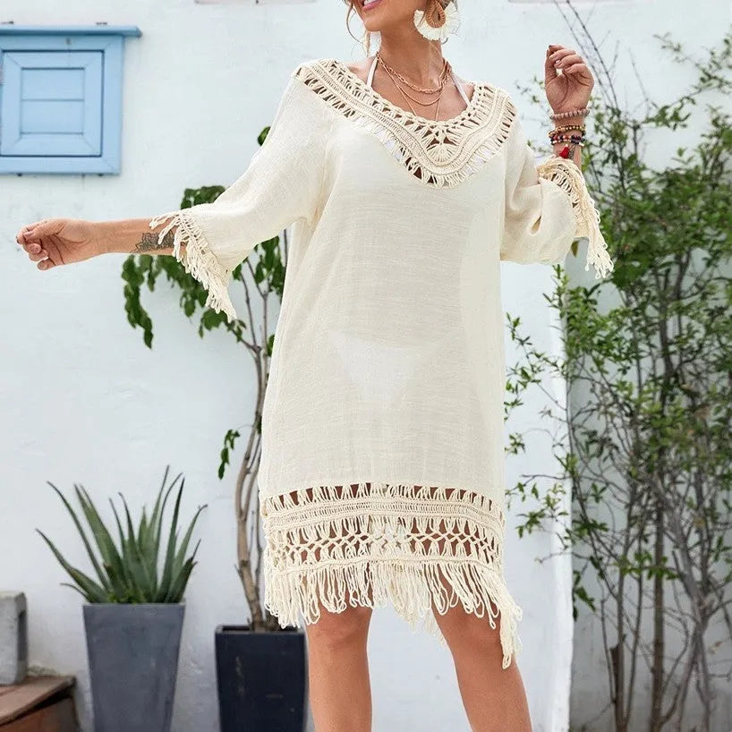 Apricot coloured women's crocheted patchwork dress with half sleeves on a hanger