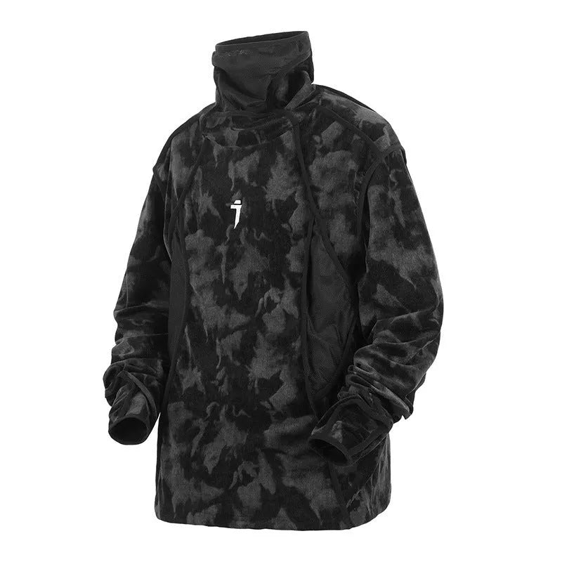 Man wearing a black and grey tie dye printed finger turtleneck sweater with drop shoulder sleeves.