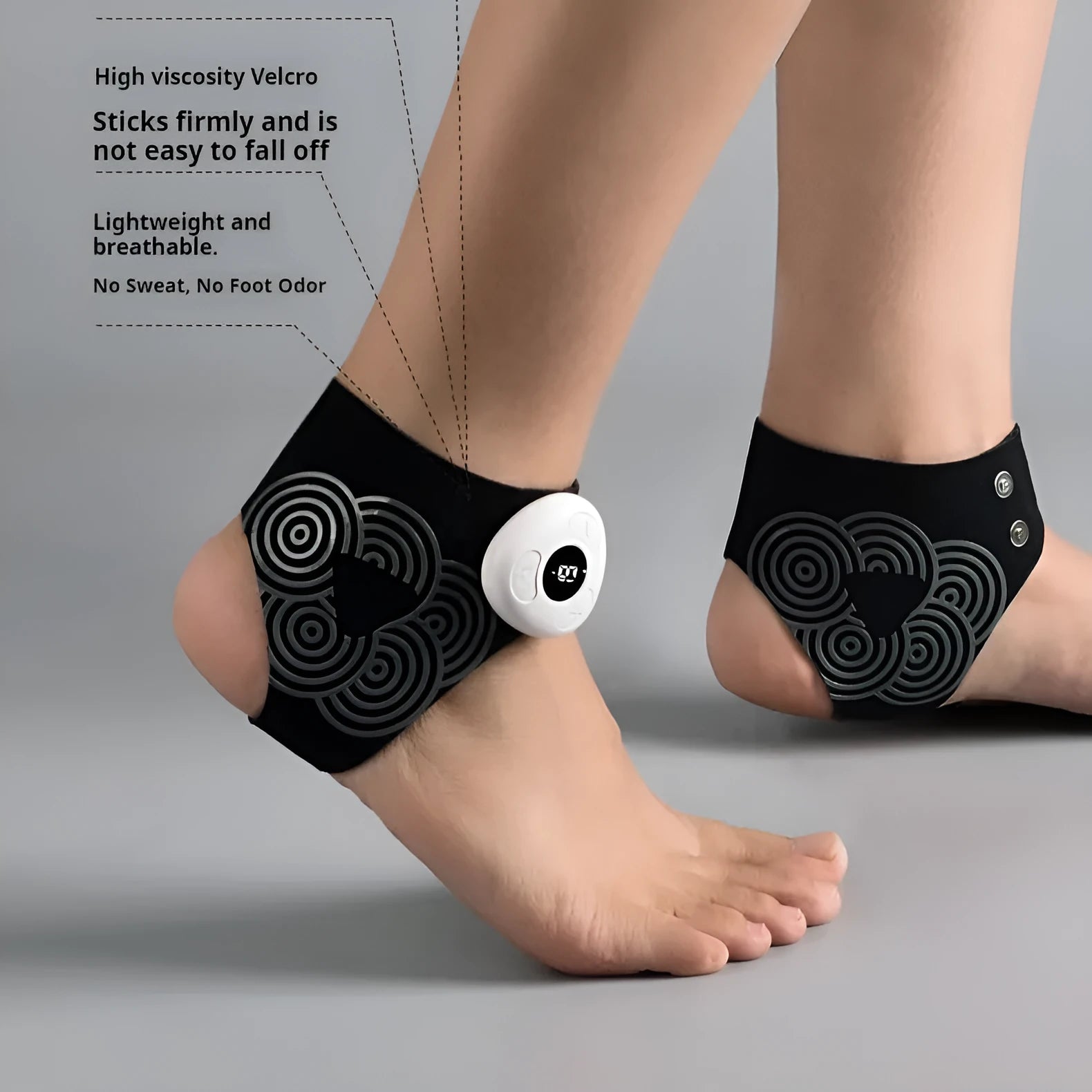 Black sports anti-odor foot massager with adjustable ankle strap and spray bottle on a table