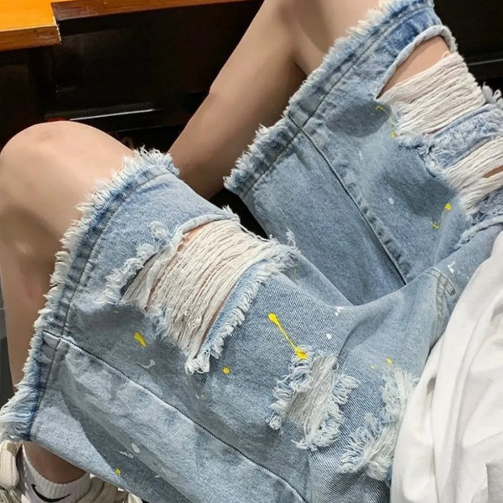 Men's water washed hole denim shorts in loose fit street style, available in black and light blue