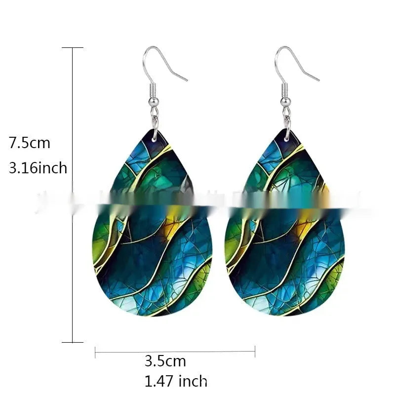 Clear acrylic drop earrings with flat branch knot design, front view