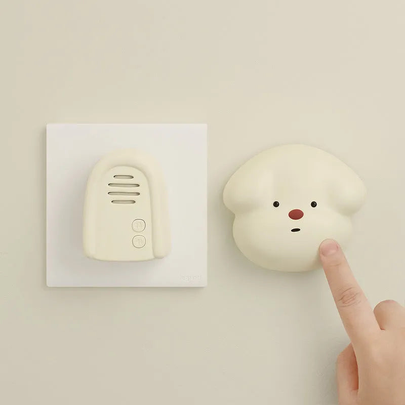 Wireless self-generating beeper doorbell unit in milky yellow or white colour with plug-in power cord.