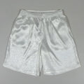 Men's black loose-fit Tang suit Tai Chi shorts with a drawstring elastic waistband on a white background.