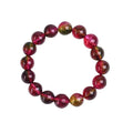 Handmade watermelon red crystal bracelet for women, shown in a casual style with pastoral elements.