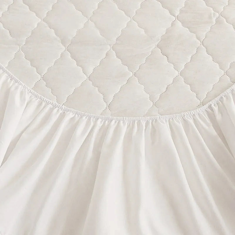 Diamond lattice quilted bamboo fibre mattress protector fitted sheet and pillowcases in solid colour.