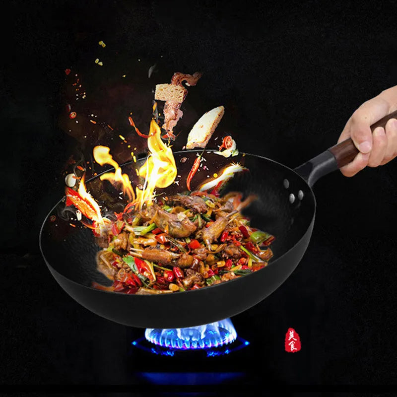 Traditional black iron wok pan with wooden handle measuring 40cm