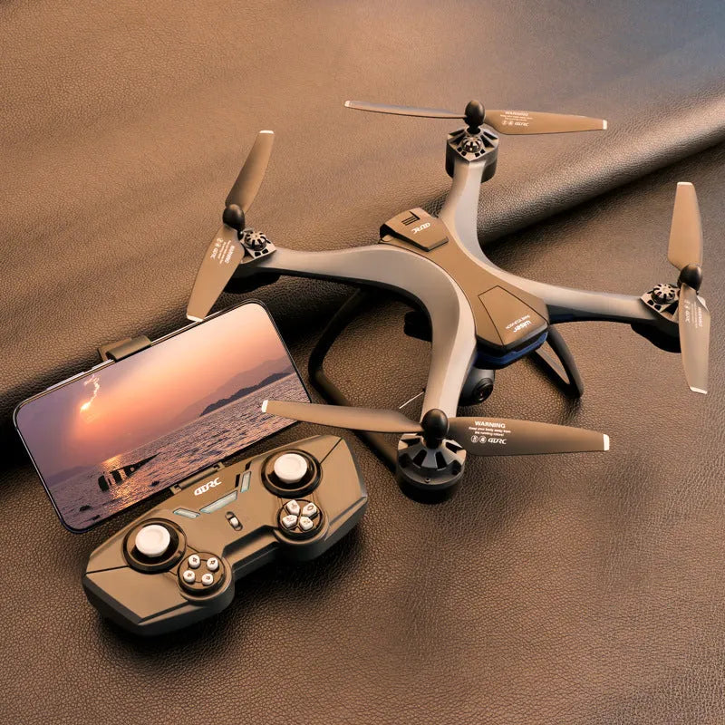 GPS quadrocopter drone with remote controller, spare blades, and landing gear on white background