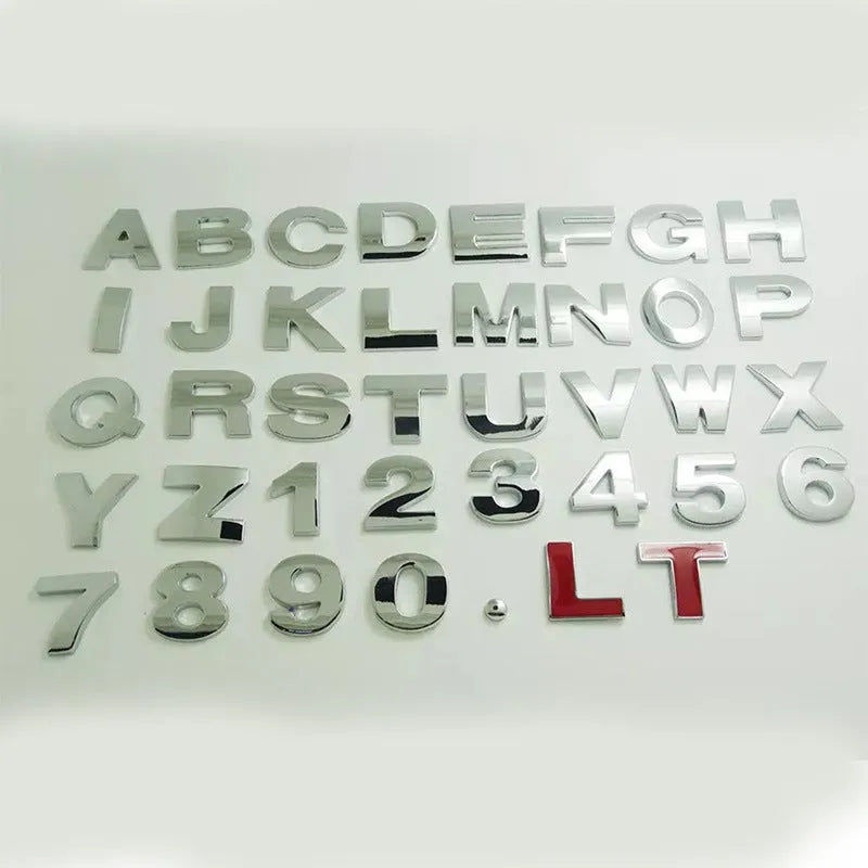 Close-up of a black metal 3D letter car sticker made from zinc alloy, showing its raised profile.