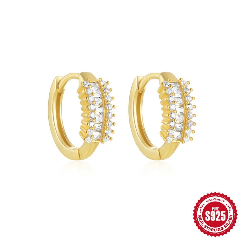 Sterling silver geometric stud earrings with small round design elements in gold or silver finish