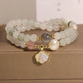 Women's crystal bracelet with an apricot leaf pendant and gold-plated gemstone accents in a green Tianshan jade colour.