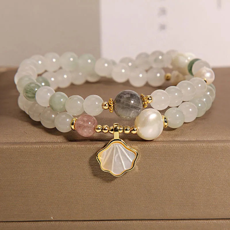 Women's crystal bracelet with an apricot leaf pendant and gold-plated gemstone accents in a green Tianshan jade colour.