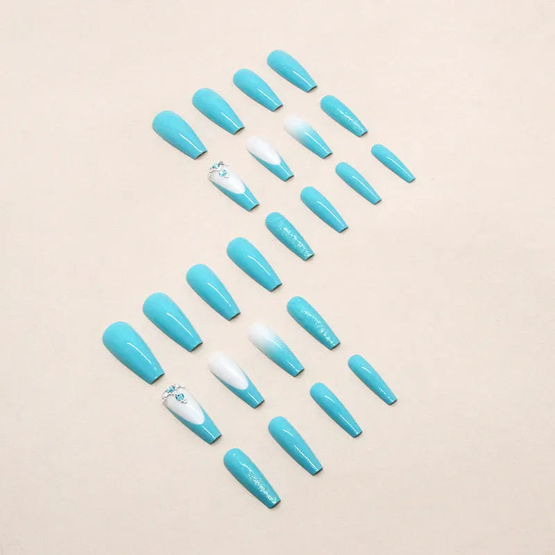 Smart blue diamond press-on nails with long ballet shape and debris pattern