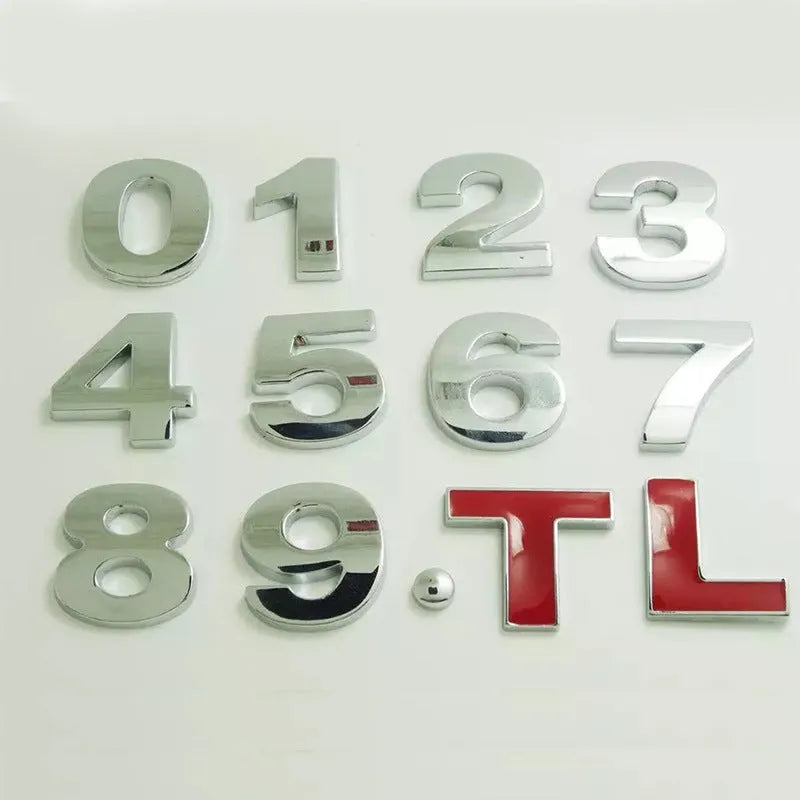 Close-up of a black metal 3D letter car sticker made from zinc alloy, showing its raised profile.