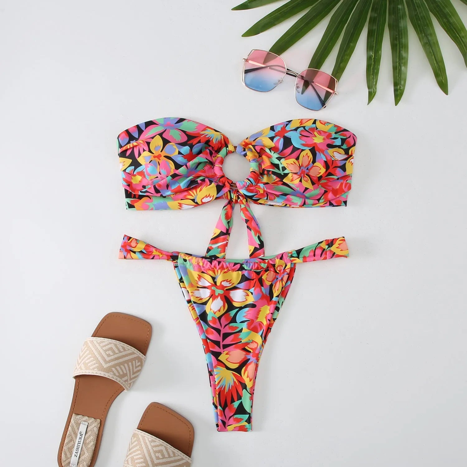 Women's floral printed tube top bikini swimsuit with brief backless design on mannequin