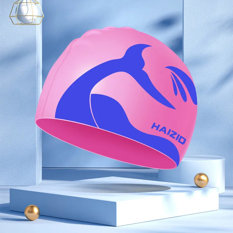 Silicone swimming cap with waterproof ear protectors showing whale tail pattern in multiple colour options