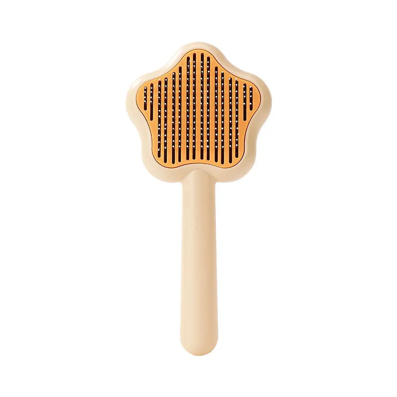 Green self-cleaning stainless steel pet comb with a magic wand handle on a white background.
