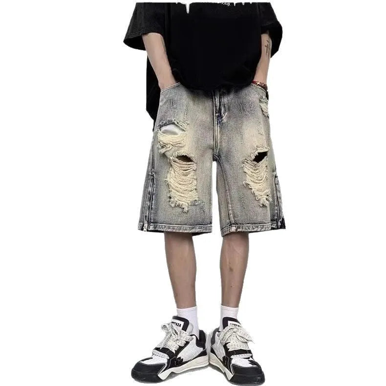 Blue retro-style denim shorts with a wide-leg loose fit and tattered details on a neutral background.