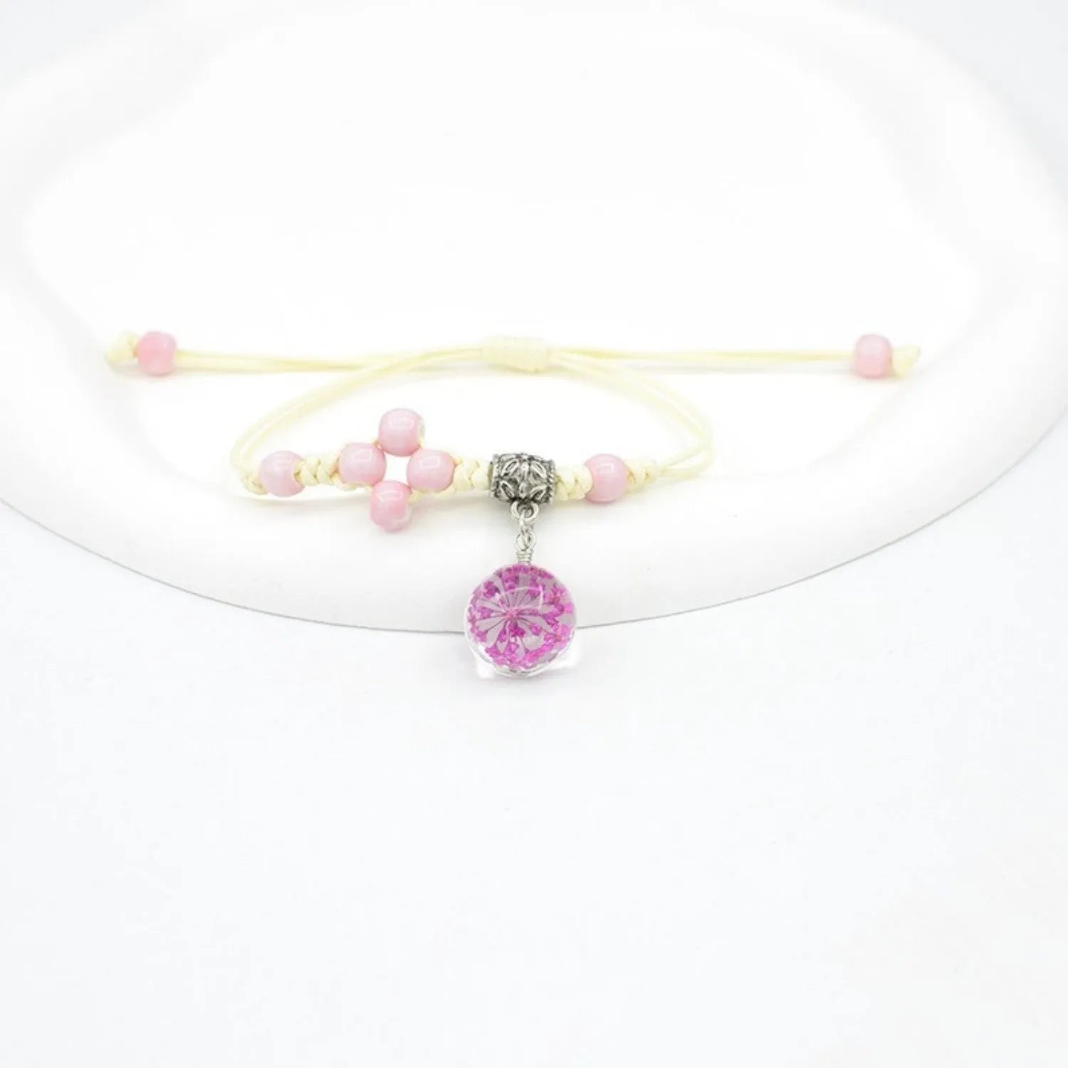 Glass dried flower bracelet with large 1.4cm beads containing real preserved flowers in hand-woven design