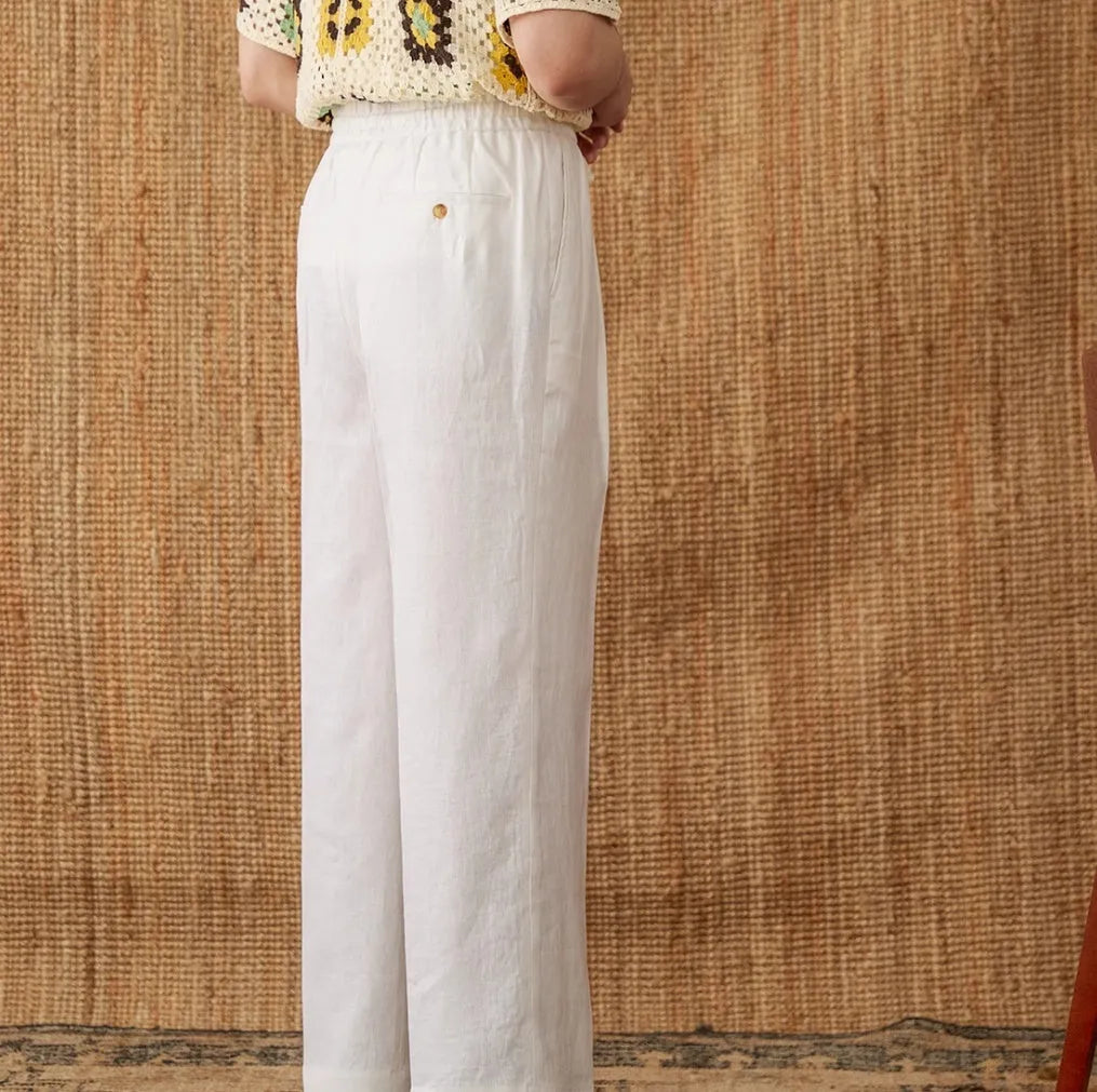 Linen straight-leg trousers with elasticated high waist and lace trim detail in navy blue colour
