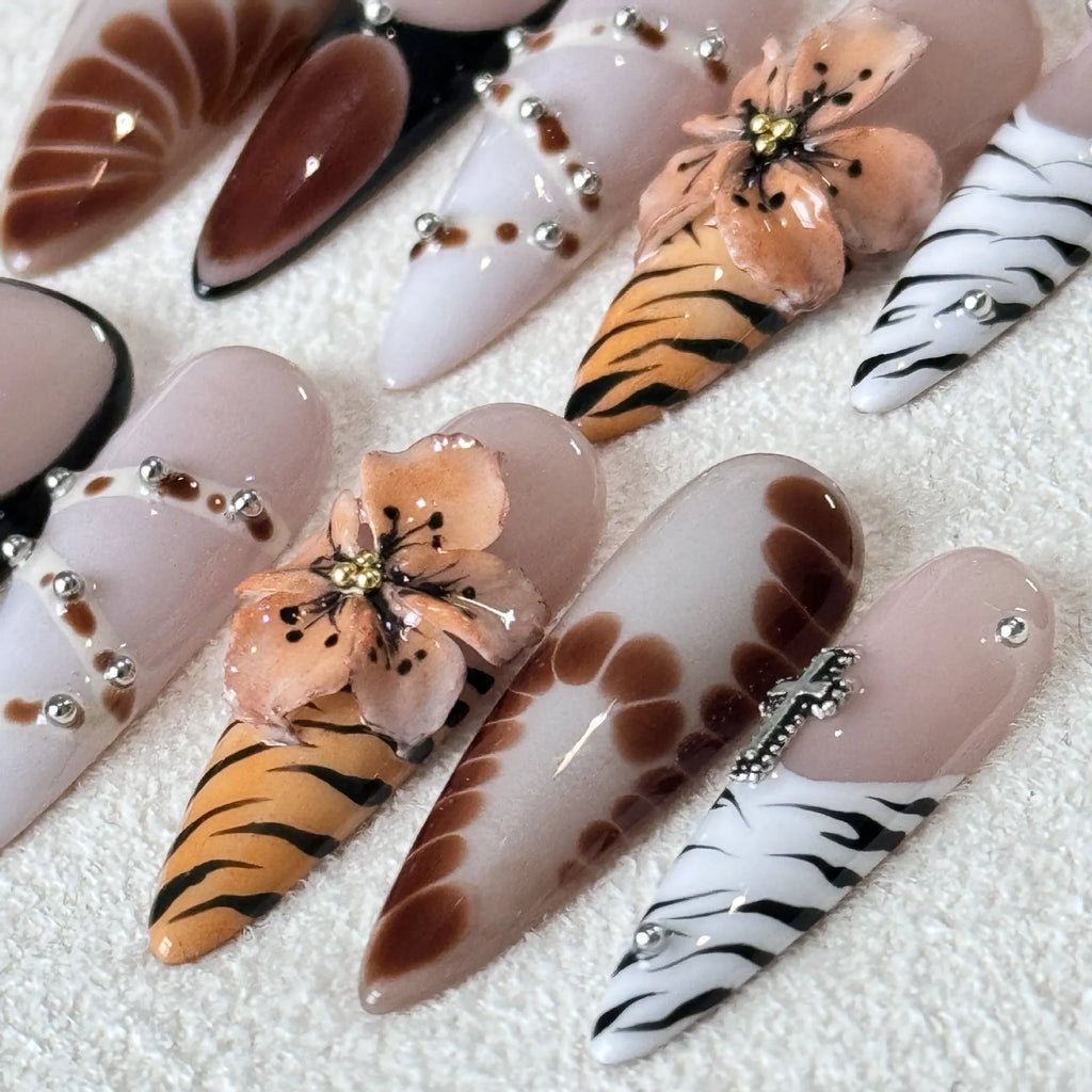 Set of long-tip nail stickers featuring leopard print, cross, and flower patterns in four sizes.