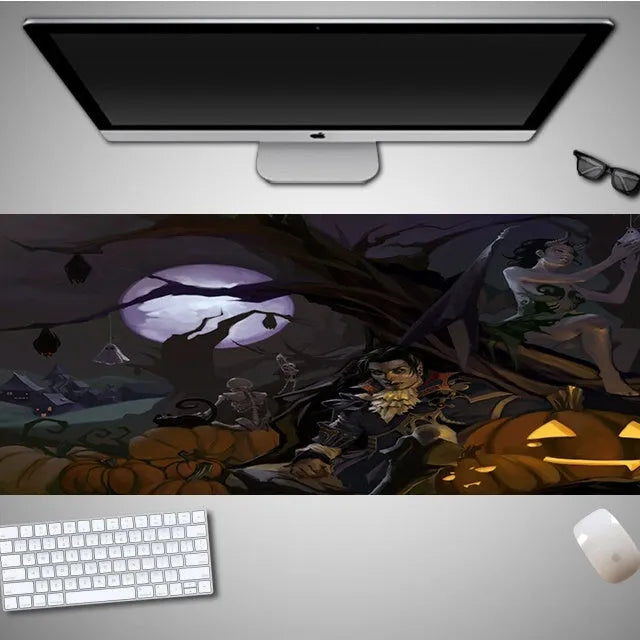 Large Halloween-themed computer mouse pad with graphic design on a desk