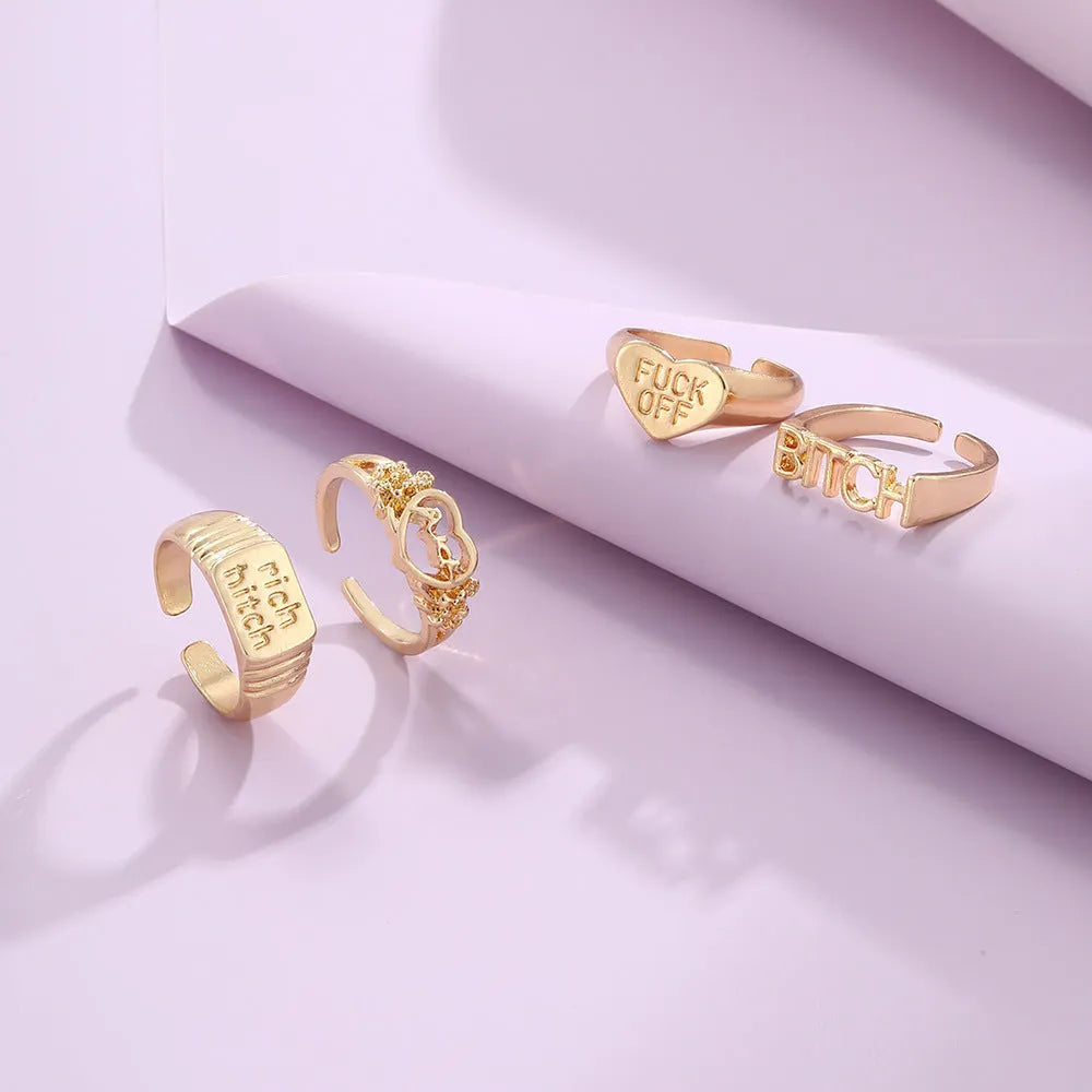 Four vintage alloy heart cutout letter rings in electroplated JH1084 colour set