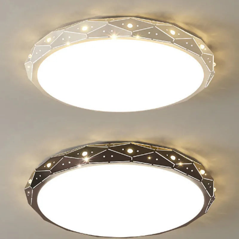 Round black and white framed LED ceiling light fixture for room installation.