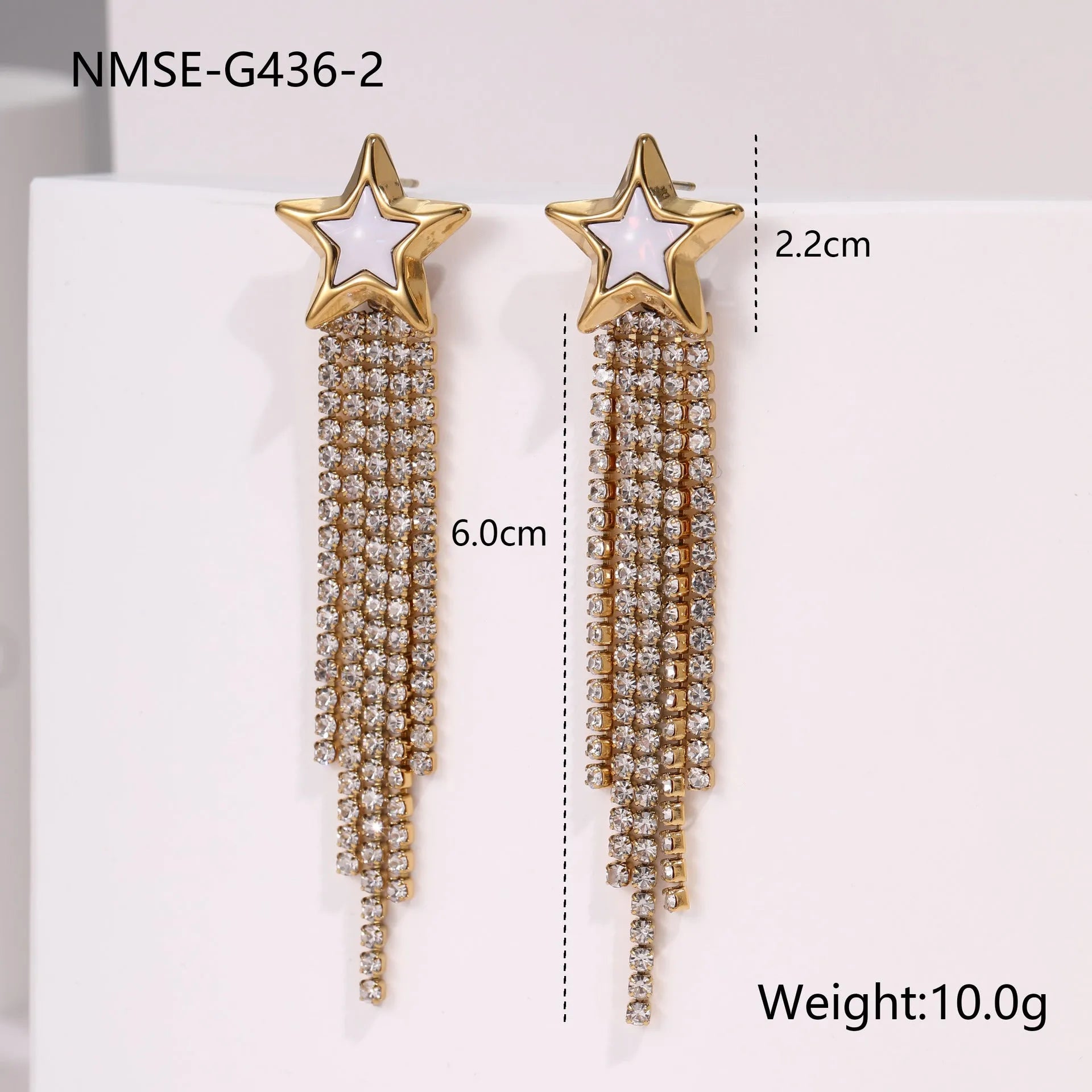 Gold electroplated stainless steel fashion earrings with heart, star, and geometric tassel design.