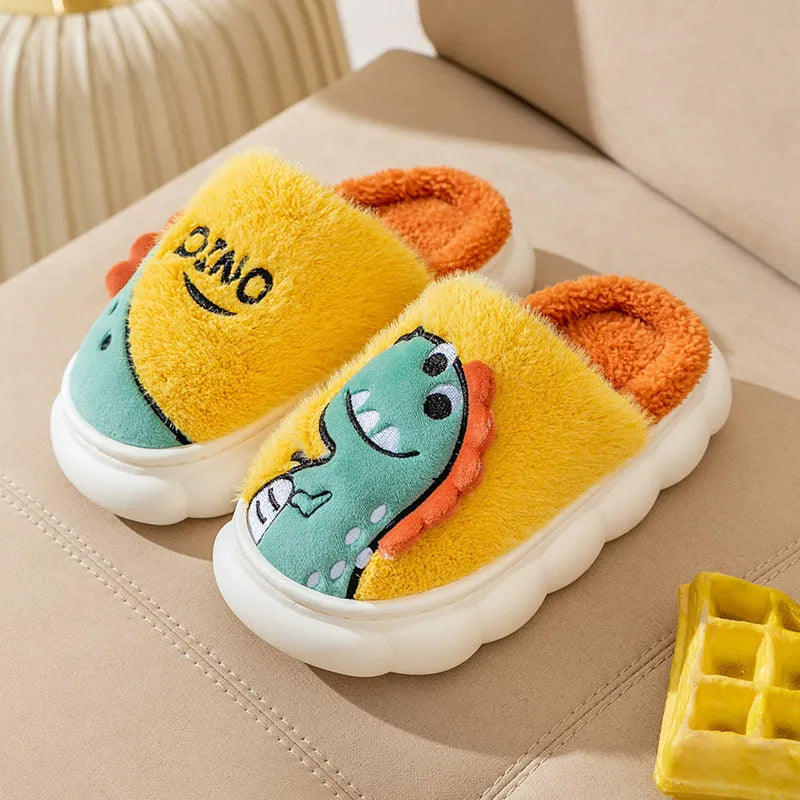 A pair of plush cotton couple slippers with dinosaur designs in coffee, grey, or orange-yellow, shown with a thickened sole.
