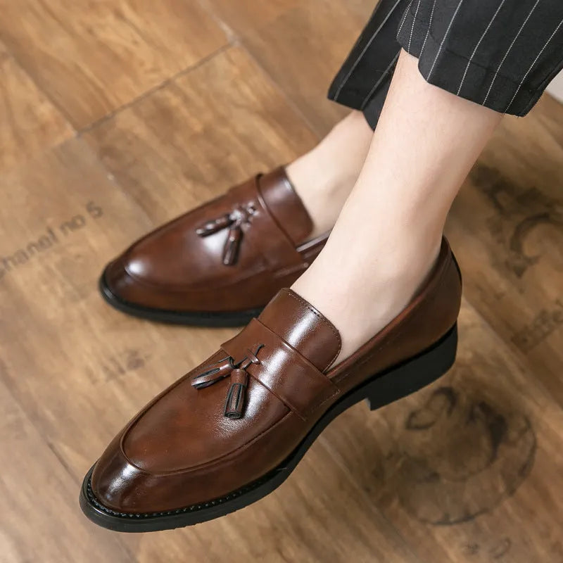 Men's black and brown business casual slip-on shoes with tassel detail and rubber soles