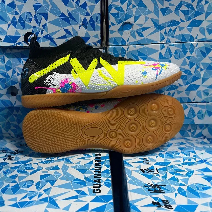 Adult football boots with replaceable studs in black and yellow colour with low-top mesh design