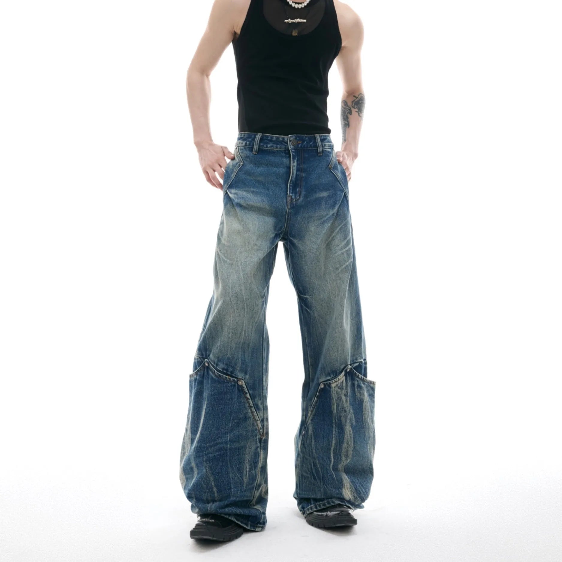 Men's verdant blue curved knife jeans with washed burst pattern and loose fit design