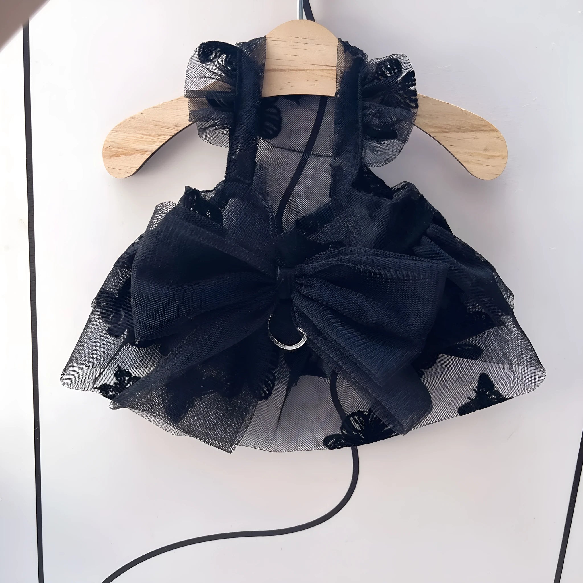 Black polyester princess tulle skirt for small dogs and cats with size chart showing chest and back measurements