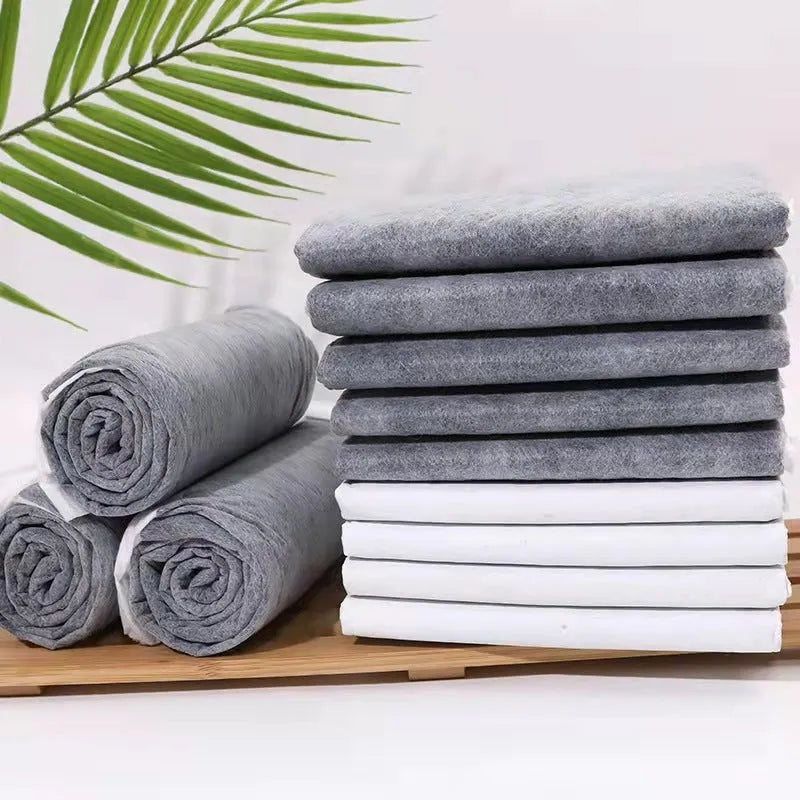 Pack of disposable pet urinal pads showing bamboo charcoal and standard models in S, M, L, XL sizes