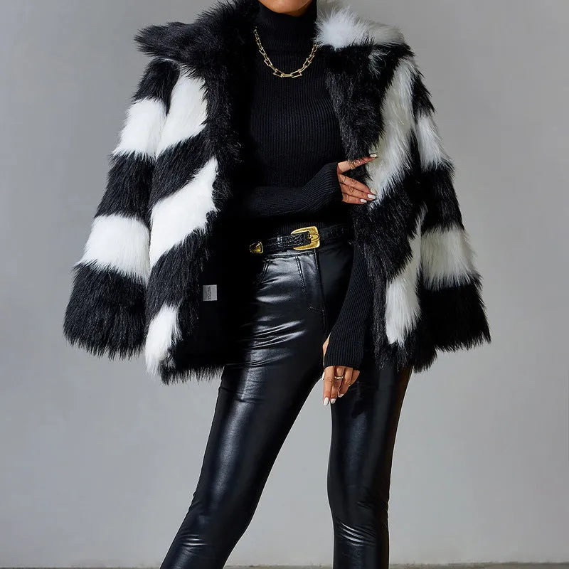 Minimalist women's faux fur coat with contrast colour lapel and a detachable fur collar.