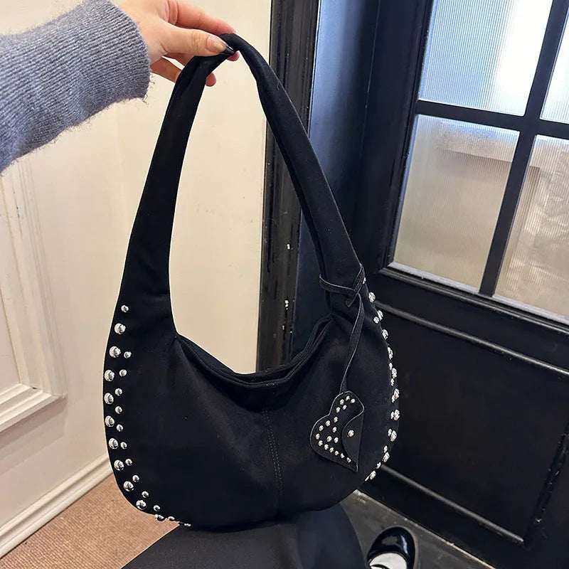 Soft plush retro tote handbag for women in a choice of colours, shown with strapless underarm carry.