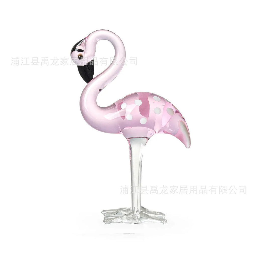 Pink crystal flamingo decorative ornament on table, available in separate or parallel styles.