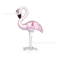 Pink crystal flamingo decorative ornament on table, available in separate or parallel styles.