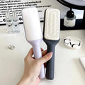 Roland purple and lunar rock grey self-cleaning hair brush with anti-static massage comb teeth.