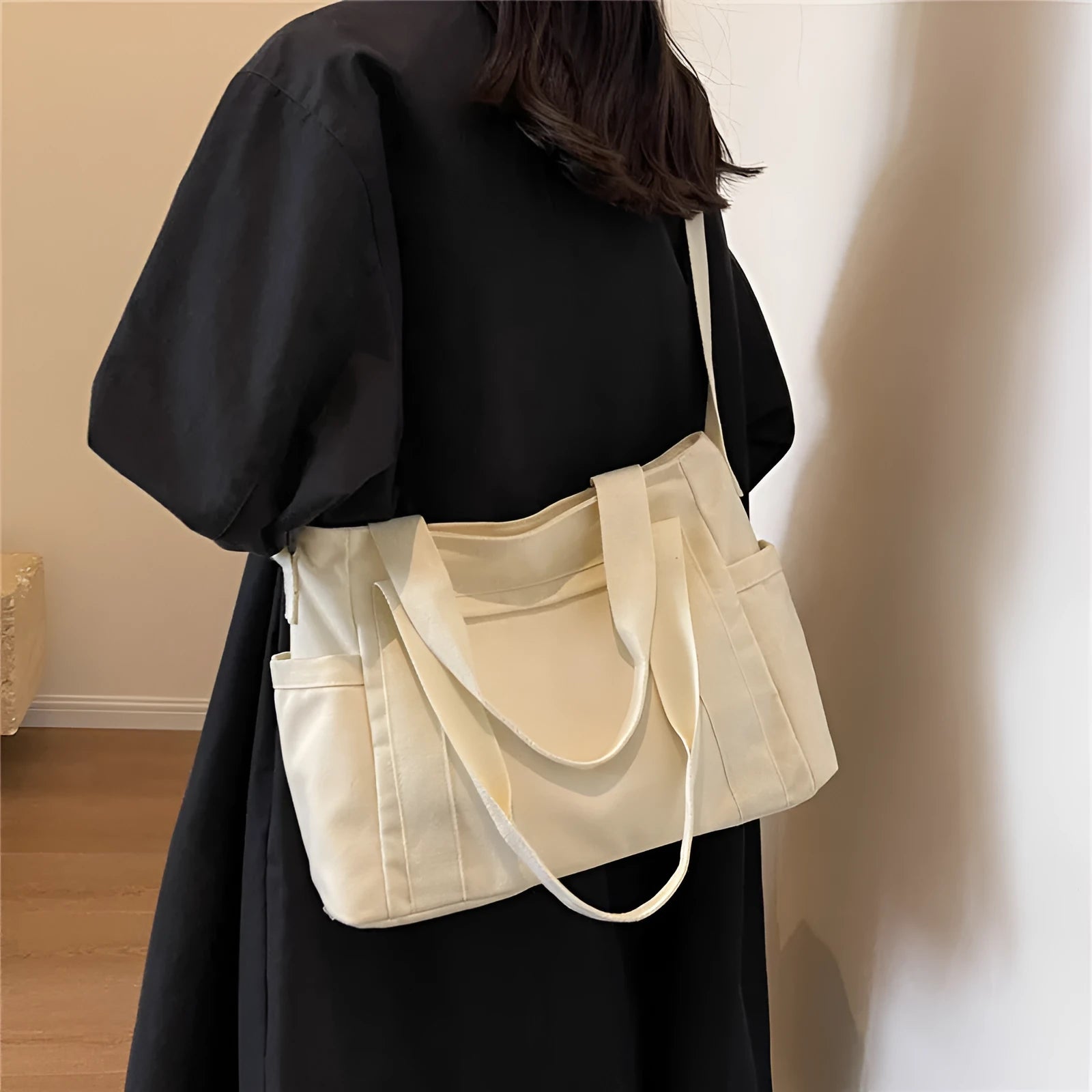 Large polyester canvas shoulder tote bag in solid colour with outer pocket and shoulder strap