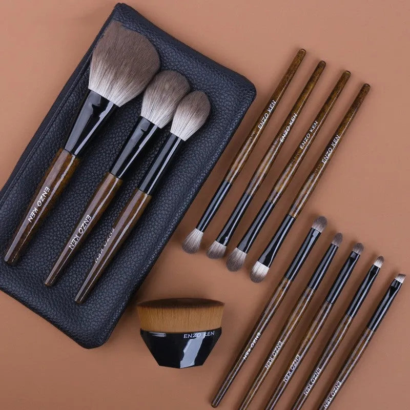 12-piece makeup brush set with wooden handles and a grey PU travel bag