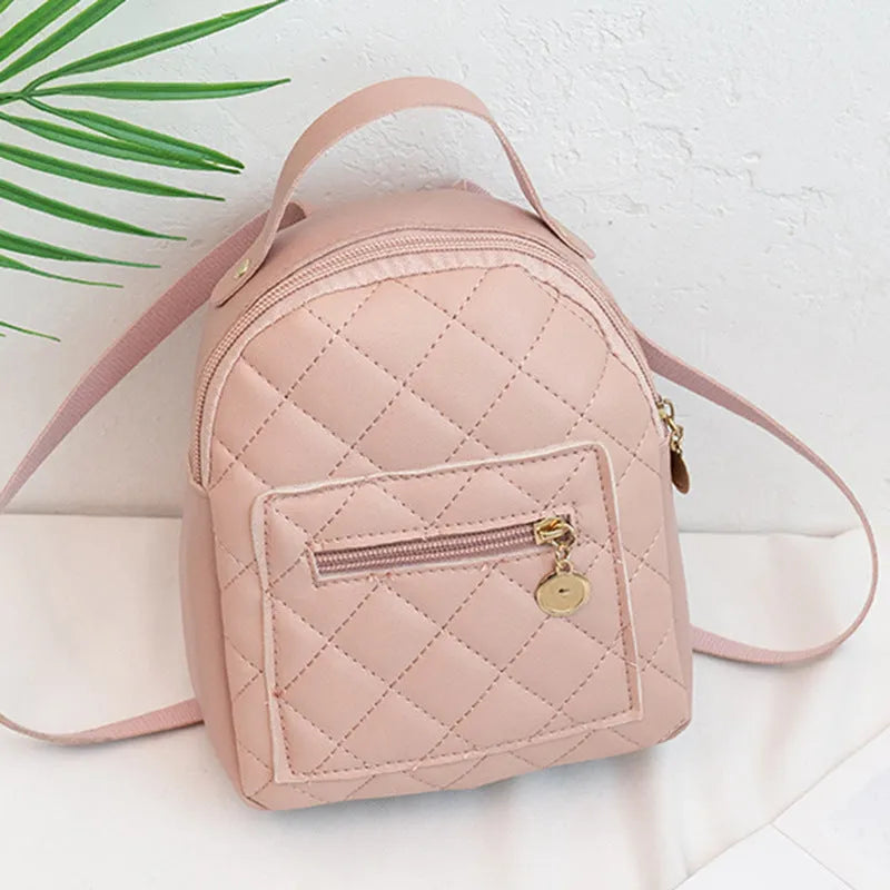 Girls' hard-shell vertical square backpack with embroidery in pink, showing front view and soft carry handle.
