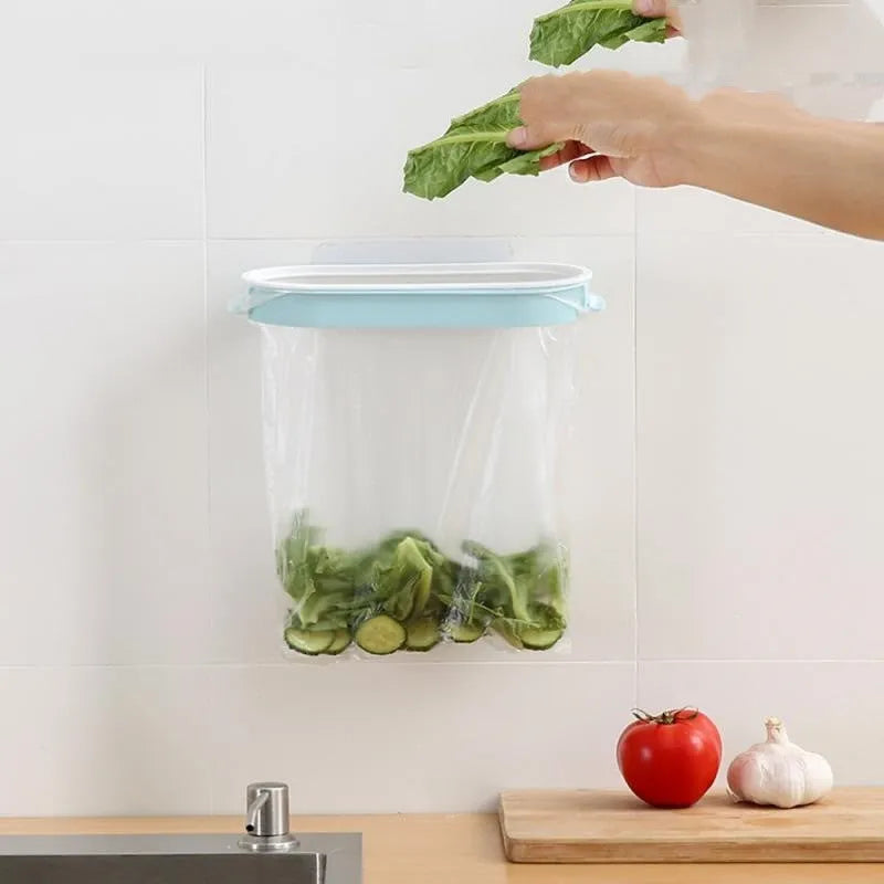 Blue plastic kitchen garbage bag storage rack mounted on wall for bin liner organisation