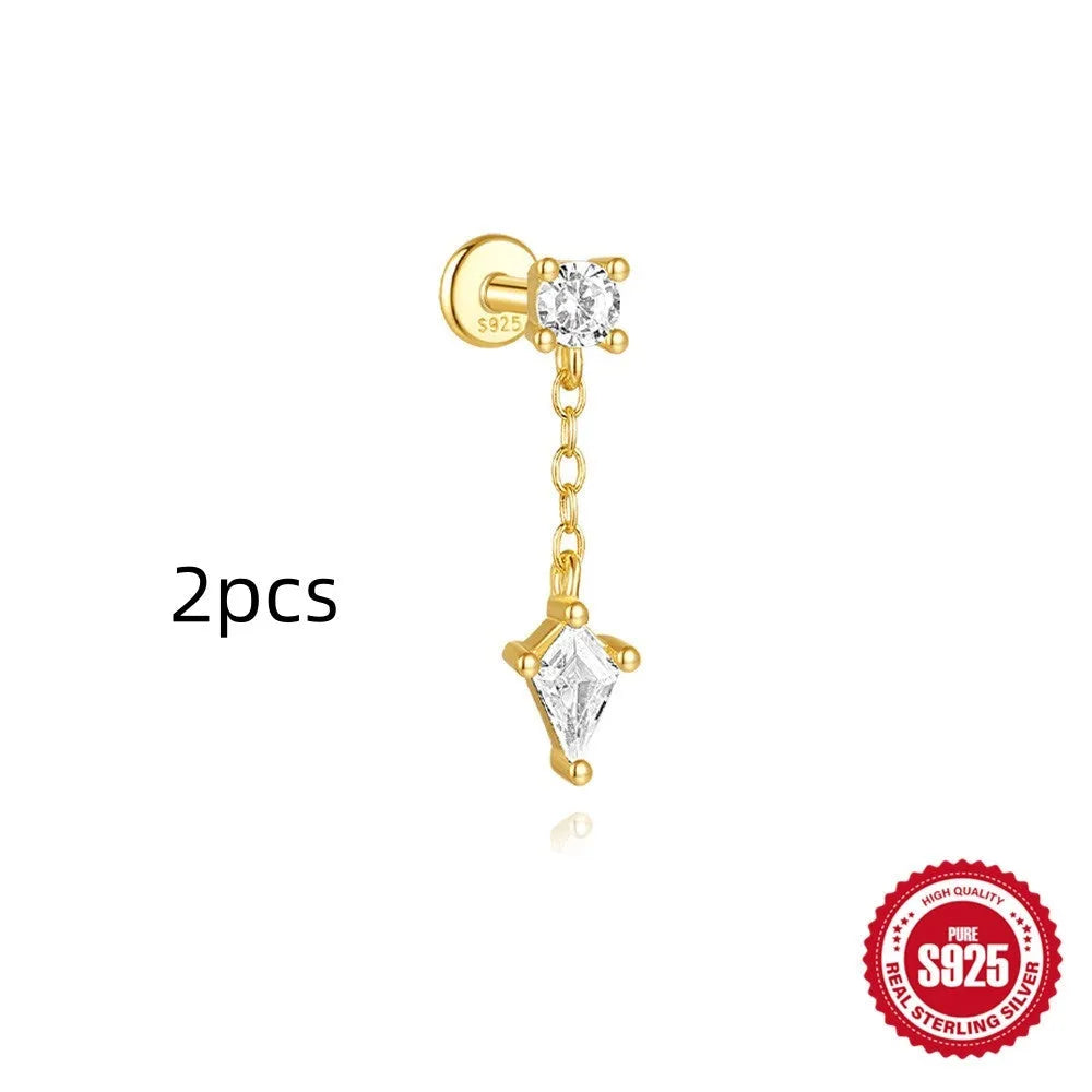 Geometric kite-shaped sterling silver earrings with a gold electroplated chain tassel featuring rhinestones.