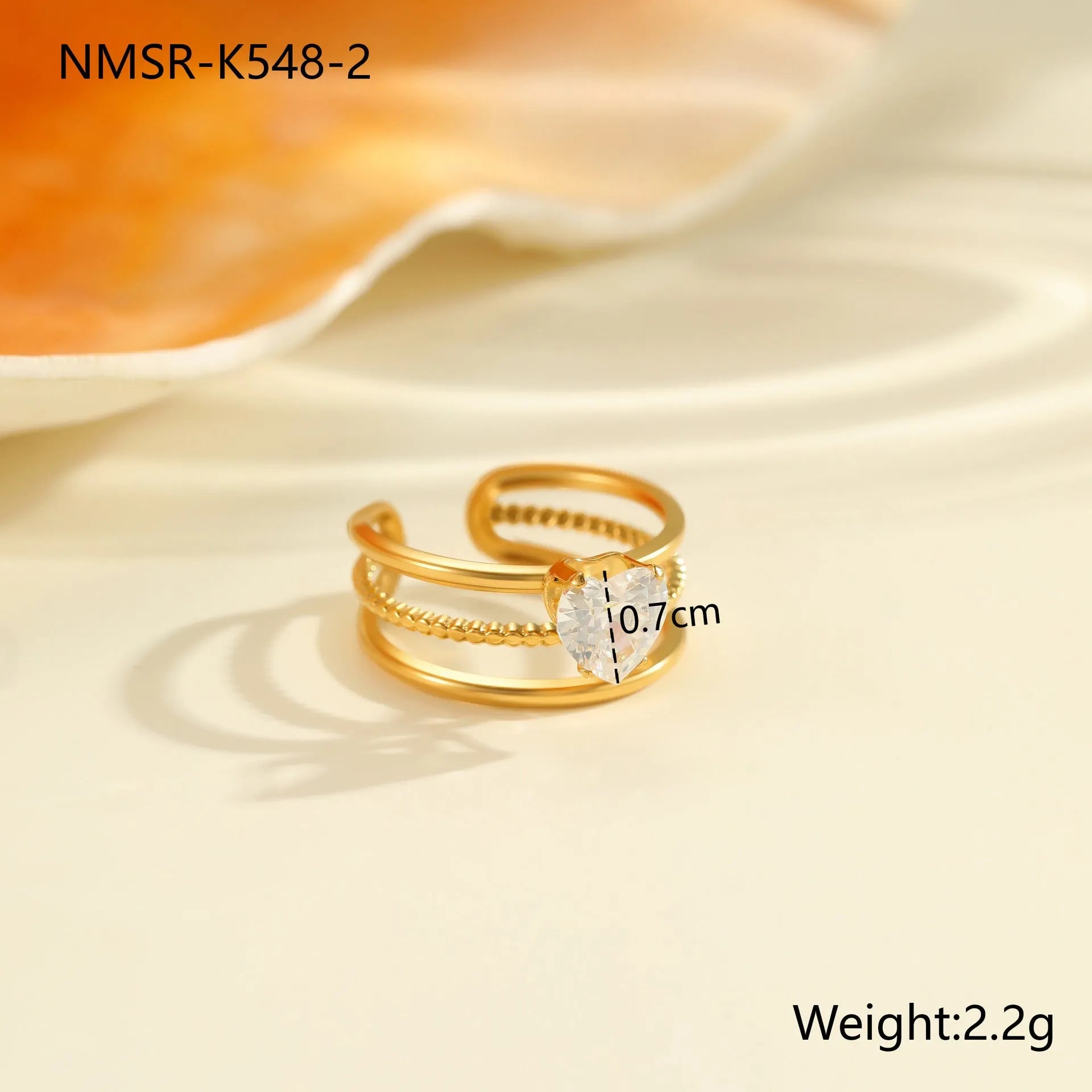 Open mouth geometric stainless steel ring with heart drop shape and gold inlaid zircon.
