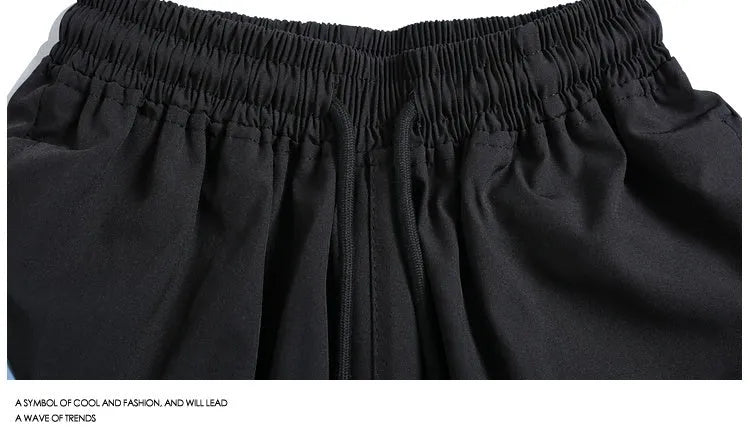 Men's black quick-drying sports shorts with elastic waistband and straight-leg cut for training