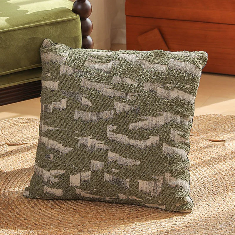 Jacquard floral pattern cushion cover in a retro colour, 45cm square, on a sofa.